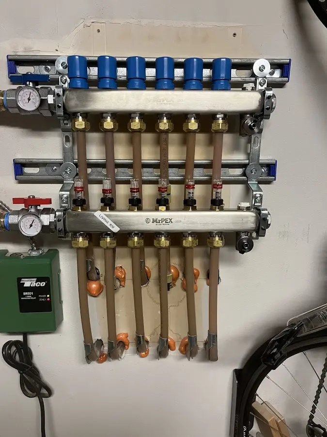 Plumber performing Water Heater Repair at a residential property in Duxbury